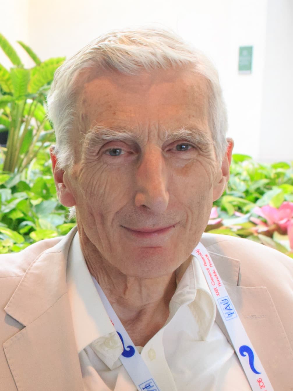 Martin Rees, white-haired, smiling.