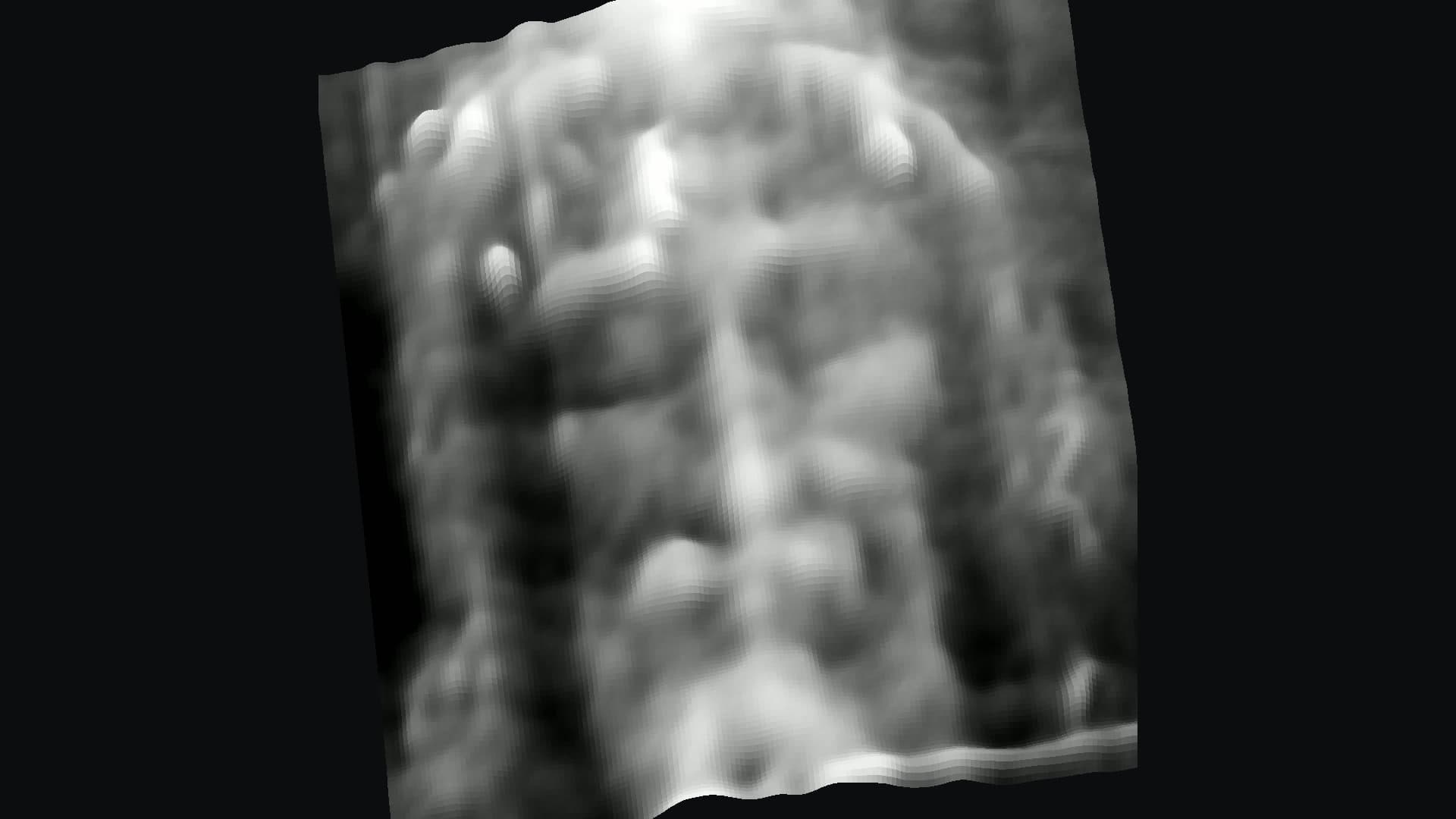 The face on the Shroud as a gray 3D surface: brow, nose, beard and hair rise in relief.